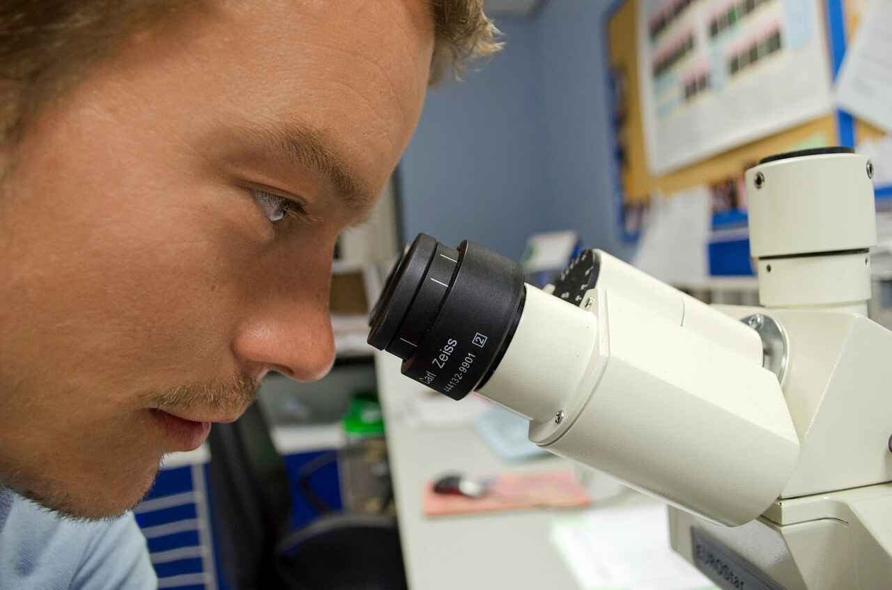 Image of of a person looking into a magnification tool